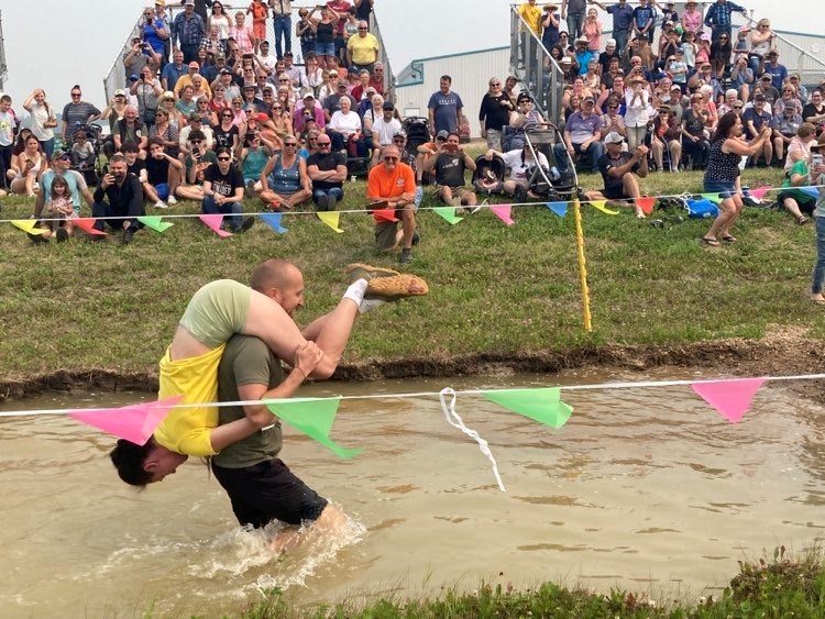 Chris and Philippa Bowman of Cairns, Australia, happened to be travelling in Northern Alberta when they decided to enter the only sanctioned wife-carrying competition in Canada, which took place in Lac La Biche at the 2023 Lakeland Country Fair. Chris McGarry photo. 