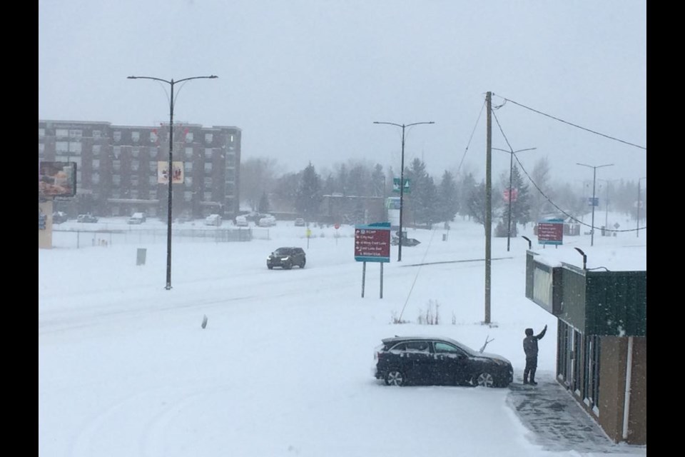 A worker at the Cold Lake Subway restaurant takes a selfie of the snowfall after he cleared the store's front walkway. / Rob McKinley photo 