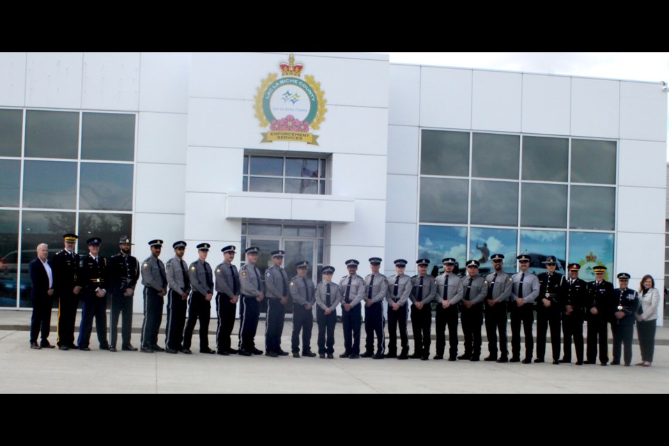 Sixteen cadets from across Alberta recently completed the 12-week Community Peace Officer Induction Program graduated. Here, they are joined by local and provincial officials during their graduation ceremony.
In photo, from left-right; Jim Peebles, Director Peace Officer Training and Standards, Tony Hanson, Superintendent Eastern Alberta District Assistant Commanding Officer, Ryan Gamble, Instructor Law Enforcement Training Centre, peace officers Sukpreet Khaira, Nav Sodhi, Ethan Walgreen, Travis Donnelly, Shanley Sawan, Christien Arcaina, Meg Talbot, Pedro Bourne, Montana Thompson, Logan Bair, Henry Klassen, Dartanian Stuart, and Sukchain Khaira, John Longstaff, Lucas Stauffer, Instructor Law Enforcement Training Centre, Shahin Mehdizadeh, Chief Lethbridge Police Service, Gary Graham, Chief Superintendent Eastern Alberta District Commander, Chris Clark, Director Law Enforcement Training Centre, and Tammy Spink, Law Enforcement Oversight and Standards Public Safety and Emergency Services. Chris McGarry photo. 
