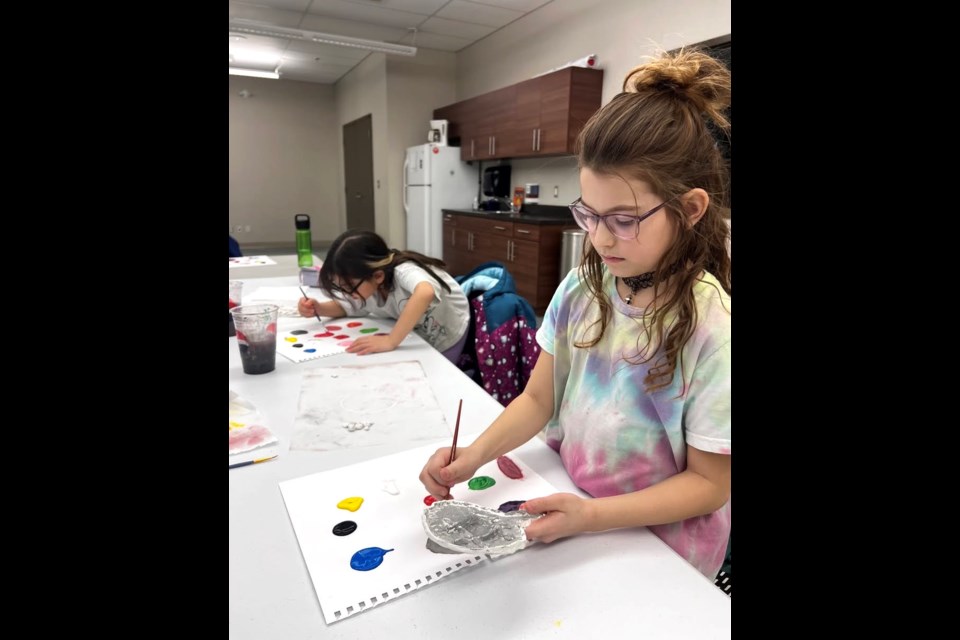 The Creative Kids Art program introduces youngsters to various mediums, including painting. Photo supplied. 