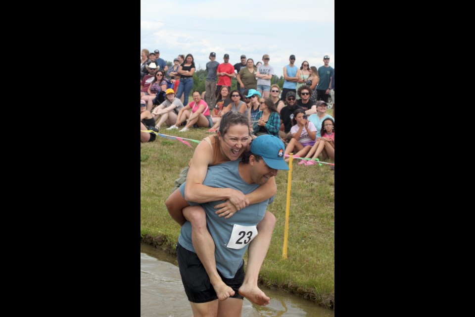 Dan and Katie Smallman wear excited faces as they race through the obstacle course. Chris McGarry photo. 