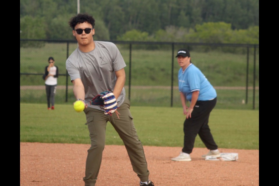 The start of the season for the Lac La Biche Mixed Slo-Pitch League featured a double header at the Bold Centre ball diamonds. While AMC and The Dirty Dozen faced off against each other in field one, Smooth Operators and Cousins in Dozens, whose roster is comprised of players from the Kikino area, played in field three. Dayton Partaker of Cousins in Dozens was pitching for his team during the league’s opening night on Tuesday, July 2. Chris McGarry photo. 