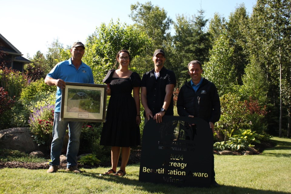 From the left - Reeve Barry Kalinski, Michelle Pitt, Jason Pitt, and Deputy Reeve Josh Crick. Michelle and Jason are the winners of the Rural Beautification Acreage Award Winner.