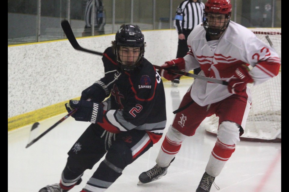 Lac La Biche Lakers player Ethan Christian is pursued by Barrett Butcher of the High Prairie Red Wings during the first playoff game between the two teams on March 7 at the Bold Centre. Lac La Biche won the game 4-3. Chris McGarry photo. 