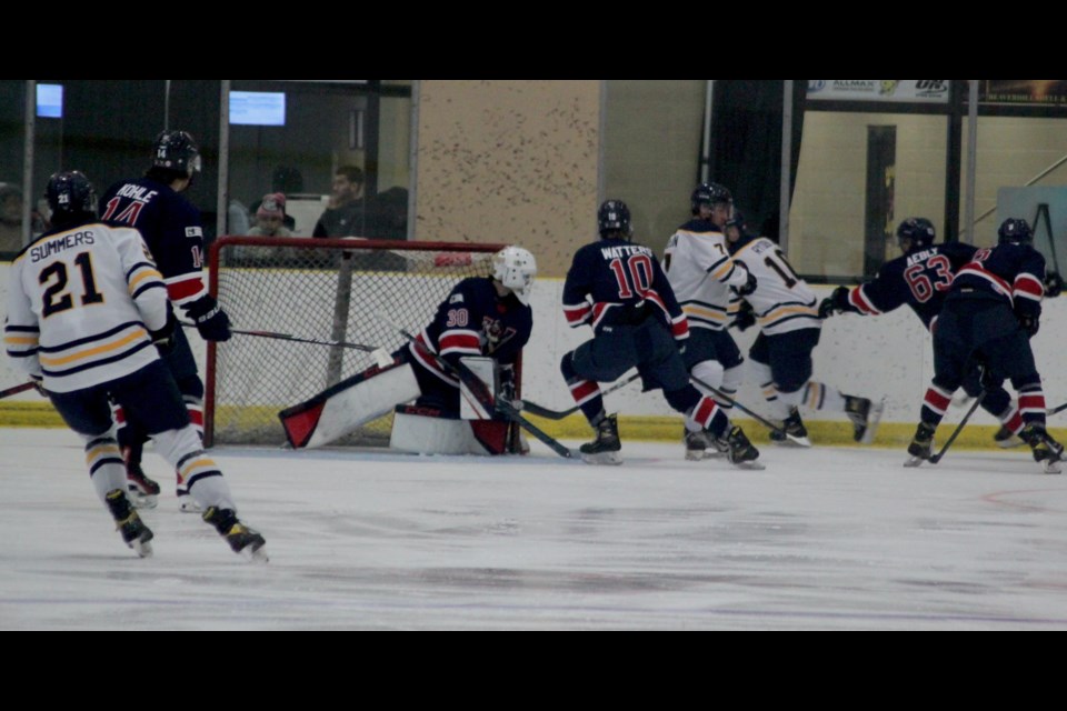 Voyageurs goaltender Ethan Shebansky watches closely as the action heats up around his net. Chris McGarry photo. 