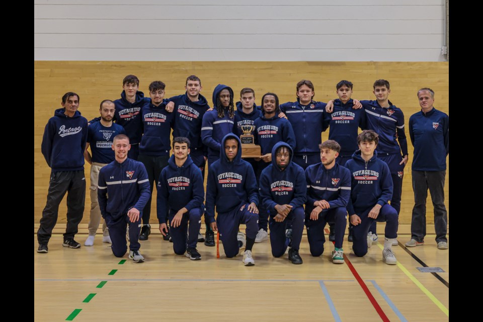 Players and coaching staff of the Portage College men's squad with their ACAC Fair Play Award. Photo credit Jaylynn Plamondon – College Athletic Marketing Specialist.