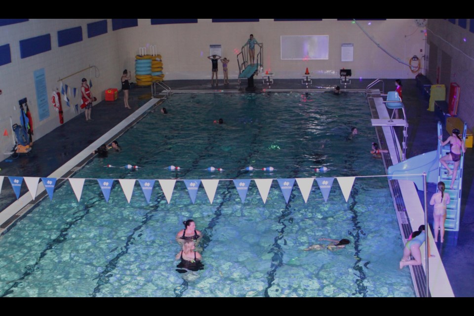 The lights were turned down during the New Year's Eve Glow Swim. / Chris McGarry photo. 