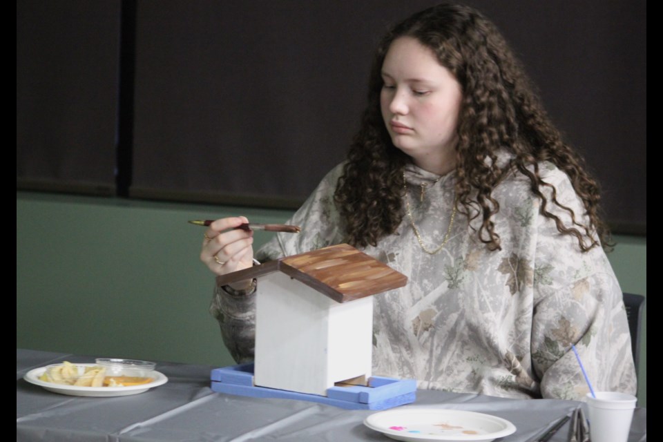 Gracie Mihalcheon works on painting a birdhouse at the most recent session of the Lac La Biche County FCSS Teen Chillzone program, which took place on Friday, Jan. 10 at the Bold Center. The program is offered for youth aged 13-18 and provides opportunities to participate in fun activities. Chris McGarry photo. 