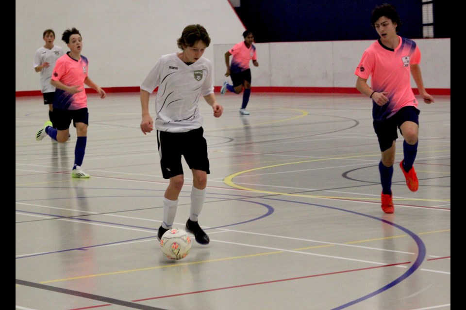 Griffin Weber of the Lakeland boys U17 team keeps his eye on Jayden Hanusz of the Bonnyville U17 team as he moves toward the Lakeland zone with the ball. Chris McGarry photo. 