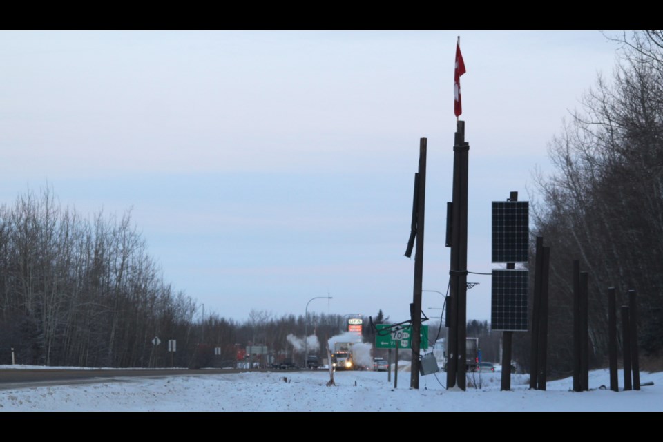 The large wooden entrance sign on Highway 36 was damaged recently. / Chris McGarry photo. 