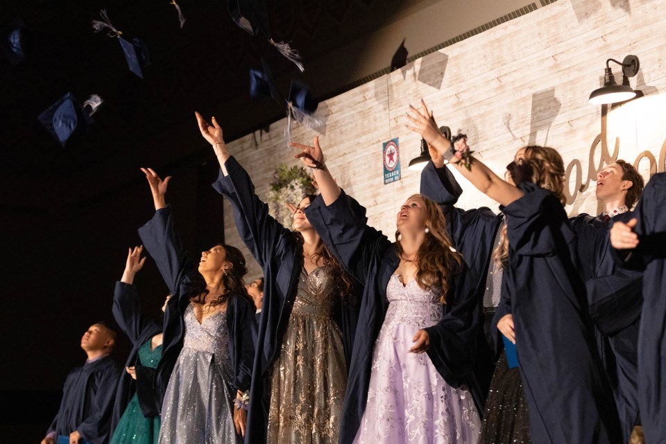 The graduating class of 2022 from École Mallaig School is pictured on the stage, May 28.