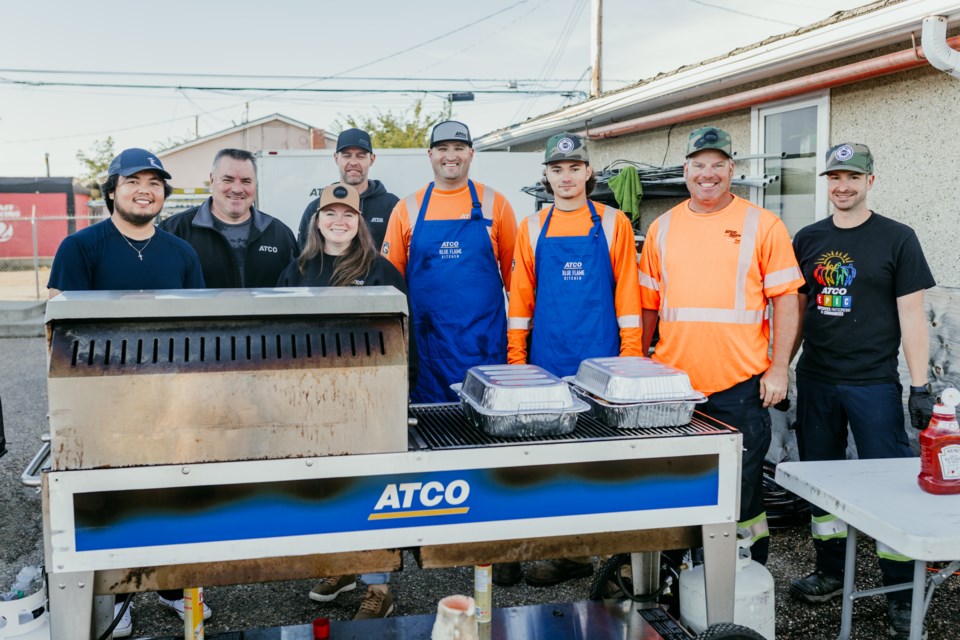 Staff from ATCO in St. Paul were busy flipping pancakes on Aug. 29 during the organization's annual rodeo week pancake breakfast.