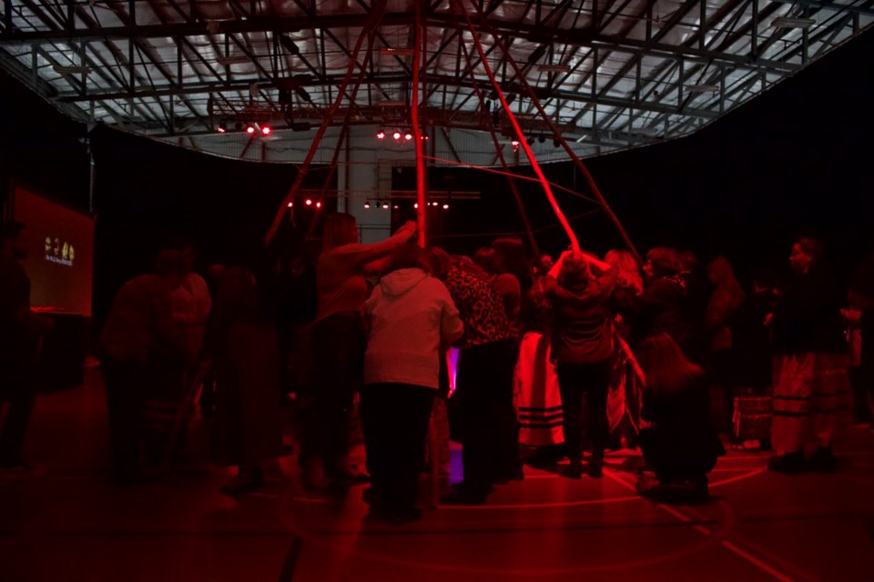 Attendees tied orange ribbons to the teepee frame, in commemoration of the MMEIP who've been lost.