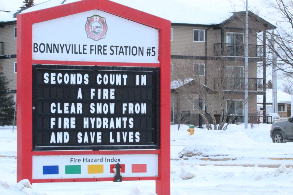 A fire hydrant is visible metres behind the latest fire-awareness sign at the Bonnyville Regional Fire Authority office.
