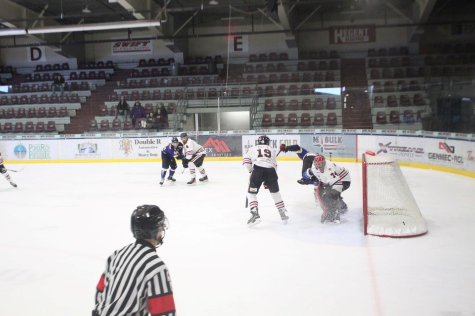 Senior Pontiacs player Brayden Labant takes a dive after scoring the winning goal in overtime.