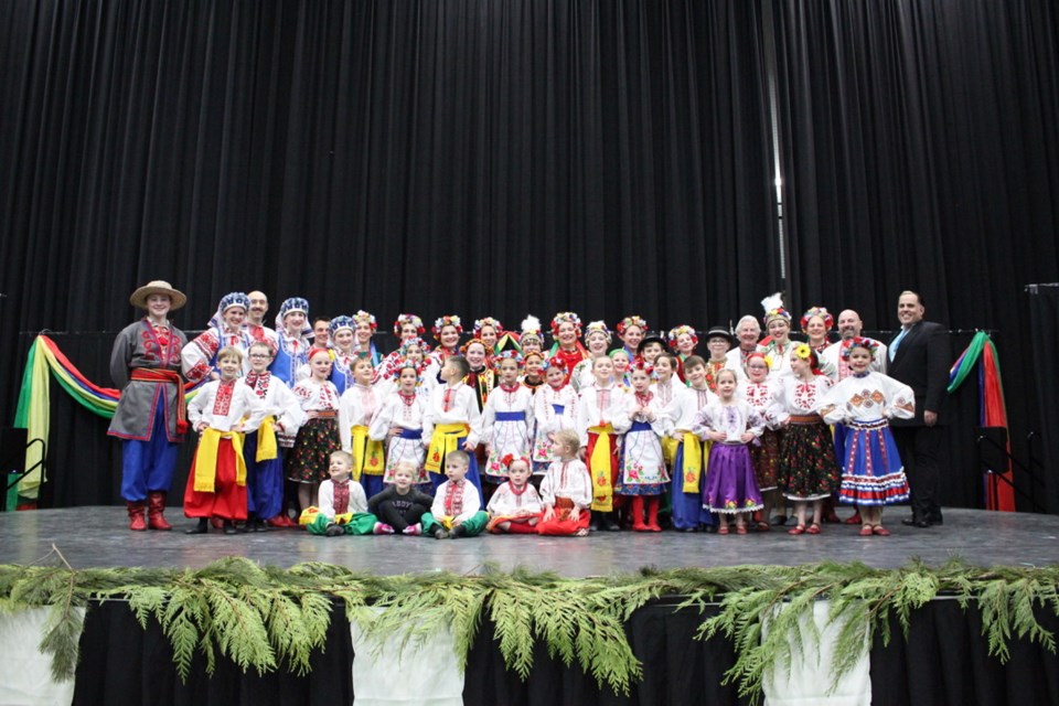 The Kryla Ukrainian Dancers piled on stage for a final bow and photo after their bright and lively performance at their Malanka event.