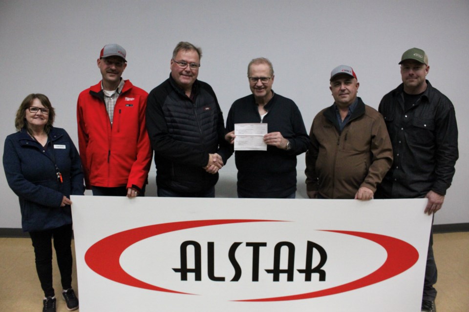 Alstar Group sponsored the C2's movie theatre, making it free to the public. From the left, Debbie Dallaire, Matt Zoethout, Doug Nicholson, Kelly Skotnitsky, Mike Hofer, and Chris Maguire.