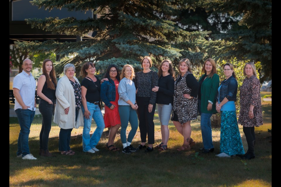 The Bonnyville Wellness Coalition. From left to right: Michael Procinsky (Healthy Aging Alberta), Aleesha Cabay (FCSS), Bev Towe (Community member), Heather Zink (Lakeland Centre for FASD), Ingrid Seitz (The Hive), Courtney Wirachowsky (C2), Danielle Larsen (Community member), Sarah Cole (Health Promotion Facilitator), Kayla Blanchette (BV Town Council), Dawn Weber (BV Health Foundation), *Tanya Orr no longer with the BWC, Andrea Woods (Community Member)