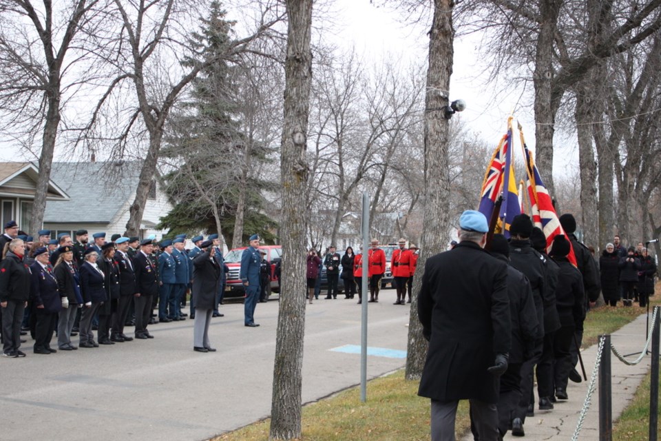 The Colour party marched the flags past WWII veteran William McGregor with members of the Bonnyville Legion and 4-Wing Cold Lake behind him.