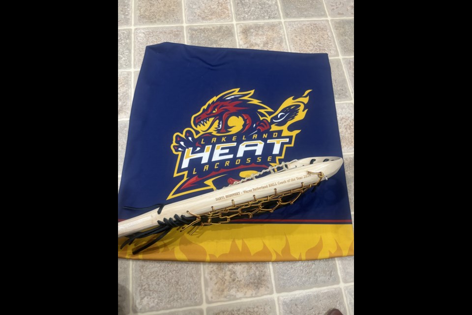 Lakeland Heat lacrosse coach Daryl Hodinsky received an engraved traditional lacrosse stick after winning the Wayne Sutherland Coach of the Year Award.