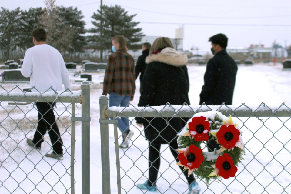 In the morning of Nov. 10, École Notre Dame High School students arrived at St. John's United Church Cemetery to lay poppies and say a prayer for local veterans laid to rest.