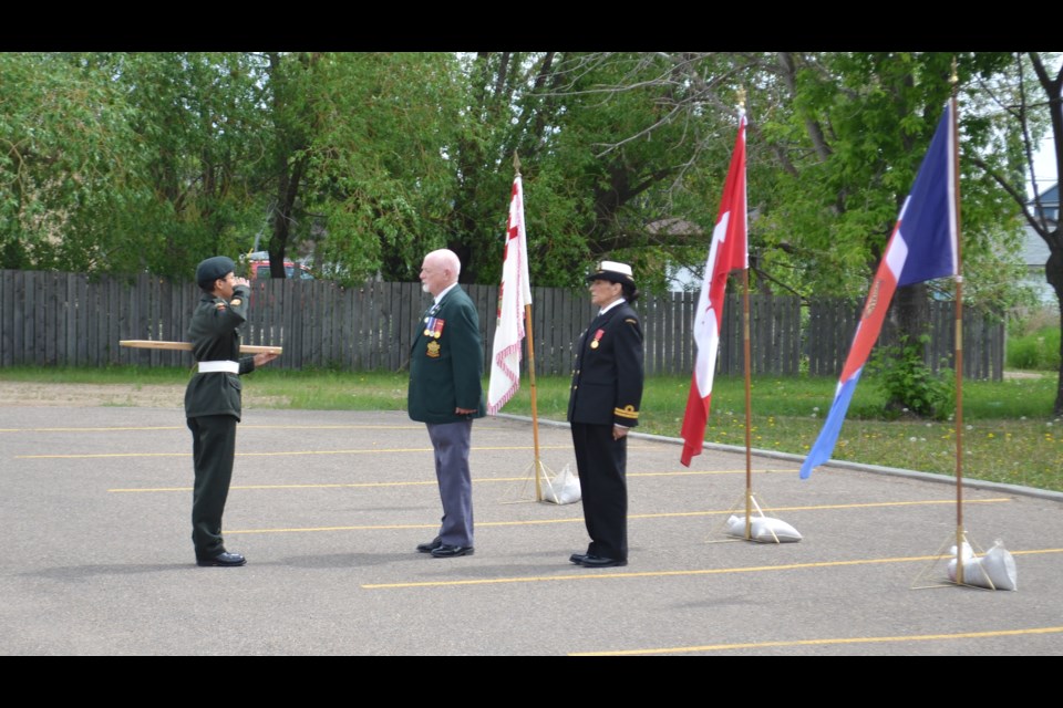 MWO Angela Whiskeyjack salutes Reviewing Officer Capt. (Ret’d) Jake Dufault and 2395 RCACC Logistics Commanding Officer Lt. (N) Sadie Hulme-Lawrence at the beginning of the Inspection.