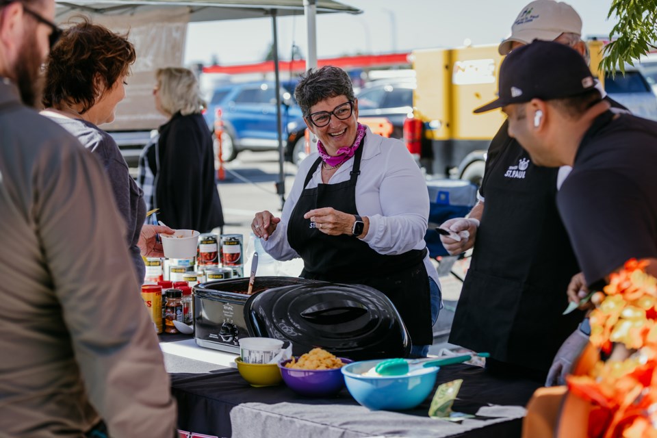 Town of St. Paul Mayor Maureen Miller serves up the winning chili.