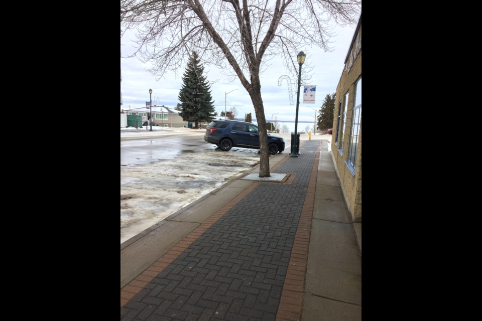 Old sidewalks along 101 Street in Lac La Biche are clear of ice and snow on December 6, while new sidewalks in the $32.5 million upgrades section of the community's downtown are proving tougher to keep clear.