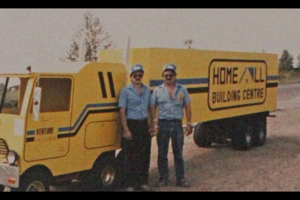 Denis and David Tardif with their store's parade-sized truck. The brothers started Lac La Biche Home-All in 1984.