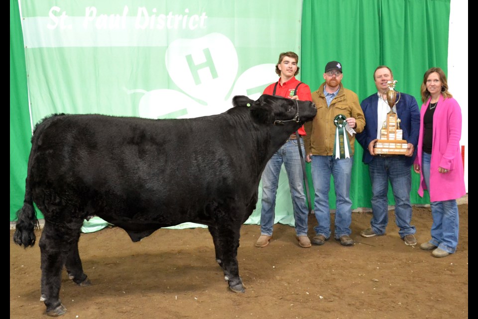 Tyson Kotowich of the Elk Point 4-H Beef Club accepted the award for the St. Paul 4-H District’s Grand Champion Steer from purchaser Aron Lundquist of Diamond 7 Meats, Lloydminster, and judges Kelly and Jenna Waltz.  This was the second championship win for the steer, earlier named the Elk Point 4-H Grand Champion on May 25.