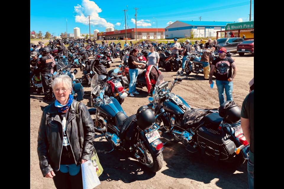 Donna Fabbro at the Alexander Community Hall among dozens of motorcycles and riders taking part in the most recent running of the Ride For Dad across the Lakeland