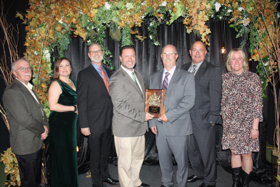 Rodger Turcotte (centre right), chairman of the Dove Centre Board of Directors, accepted a plaque from MLA Scott Cyr (centre left) recognizing the non-profit agency’s 50 years of service to the community during an anniversary gala Sept. 23. They are flanked on the left by board members Alvin Green and Vania Lawrence, CEO Robert Goulet, and on the right by Laurie Vasseur and Andrea Woods. Missing are board members Pamela Guilbault and Claudia Hubbard.