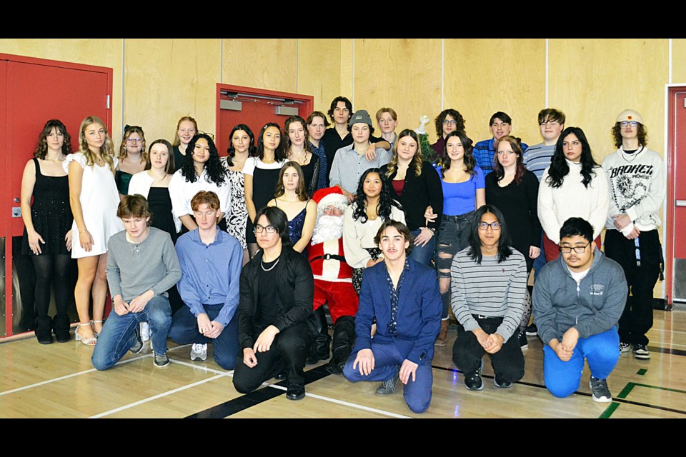 Santa was totally surrounded for one last pre-Christmas photo with F. G. Miller High School’s Class of 2025, following the school’s annual Christmas dinner on Friday, Dec. 20, as they prepared to head home for a full two-week-long Christmas break.