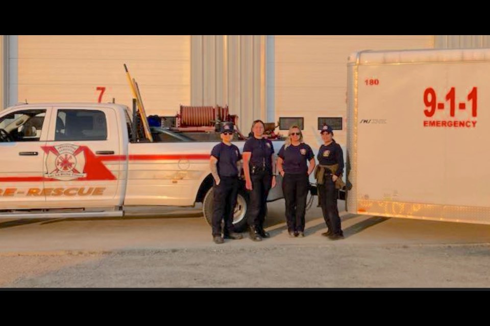 Four Lac La Biche County firefighters — all female — Rubylynn Montalban, Leah Larocque, Angelica Webb, and Nicole Cardinal — are helping to save structures in a large forest fire near Fort McMurray.
