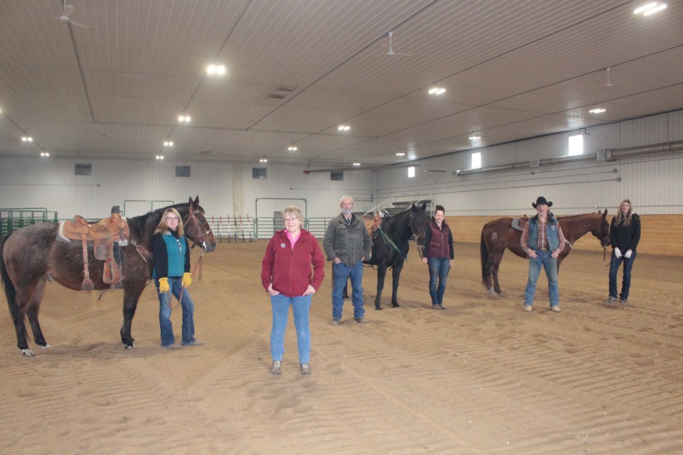 Rich Lake Rec and Ag Society board members Jeannette Pomerleau, Briget Vezeau, Rob Lawson, Raedeen Washburn, Billy Smith, and  Alanna Wowk on Sunday inside the new indoor riding arena at the Rich Lake Community Complex.   Board members not pictured: Elaine Landstrom, Laverne Attfield, Nicole Landstrom, Iris Dort, Russell Huffman, Kieran Washburn.