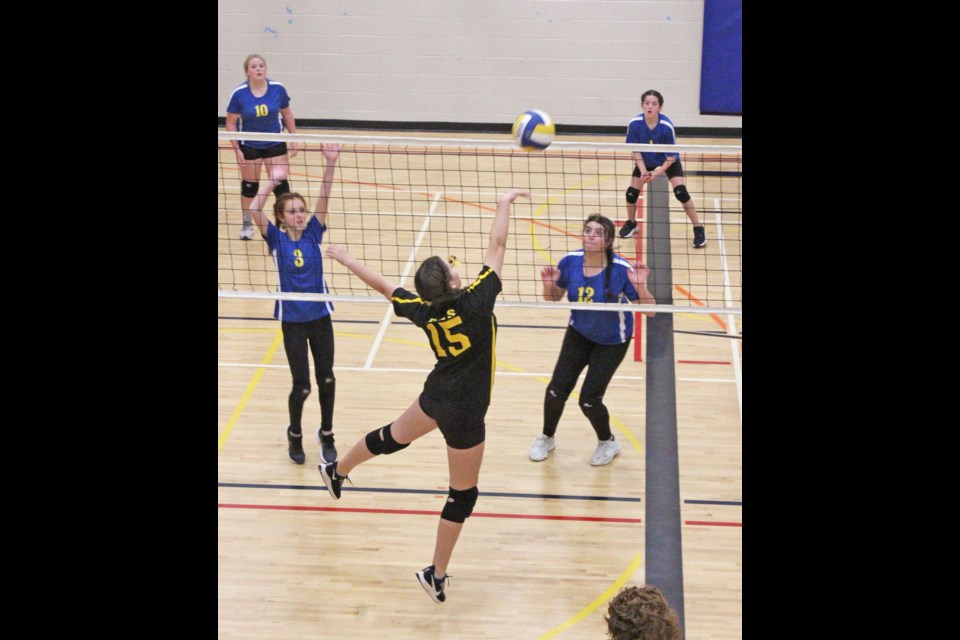 A LIght of Christ player tips the ball over the net an onto the Aurora side in one of several games at Thunder-mania this weekend.