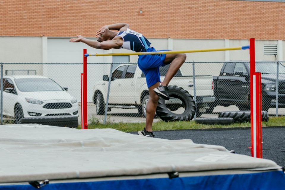 Yan Nkogo breaks the B boys' high jump record, June 4 at the junior high SPAA track and field event.