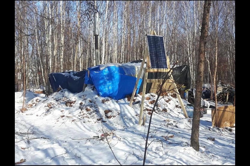 An image of the Lac La Biche encampment located in a downtown wooded area on privately-owned property.  Image suppled Lisa Marie Bourque
