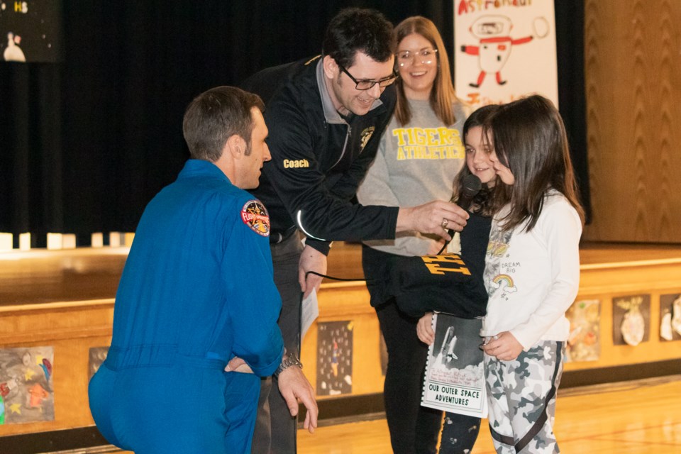 Astronaut Joshua Kutryk (left) answers questions from students. Also pictured is Two Hills Principal Collin Kupchenko.