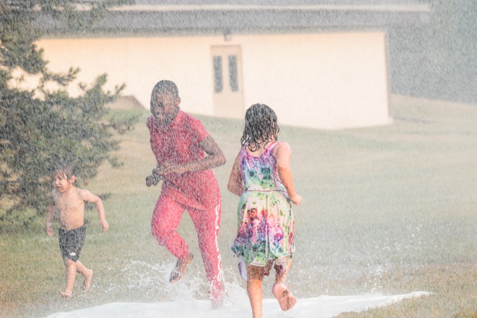 On July 18, amid the scorching weather, some members of the community headed just outside the Recreation Centre to splash on the water while the St. Paul Fire Department conducted training.