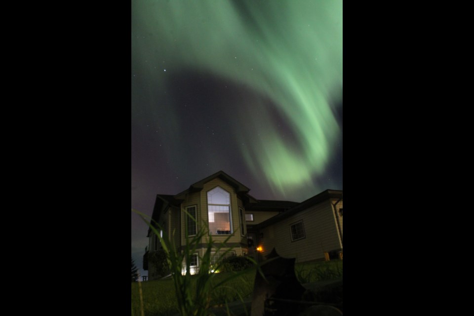 Monday night lights over a house in a Lac La Biche rural subdivision.