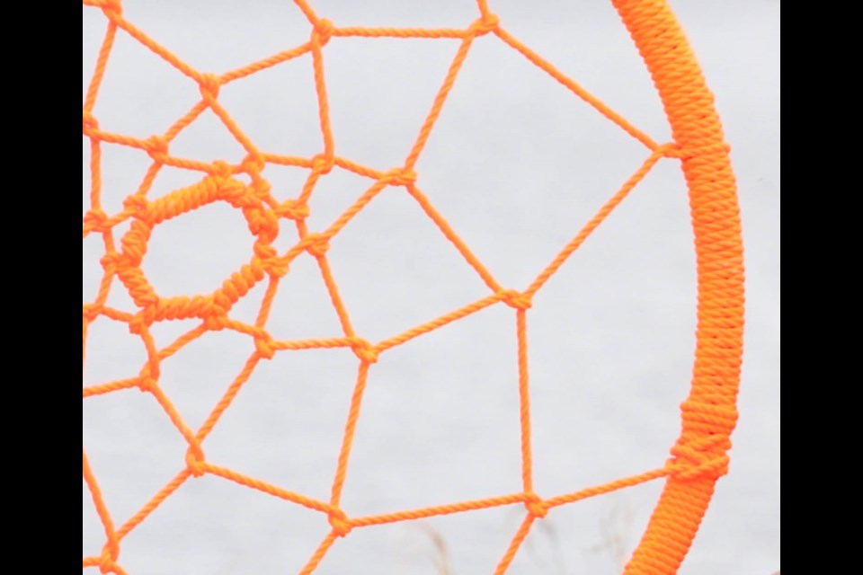 The woven pieces of an orange dream-catcher displayed at a recent Orange Shirt Day in the Lac La Biche area. 