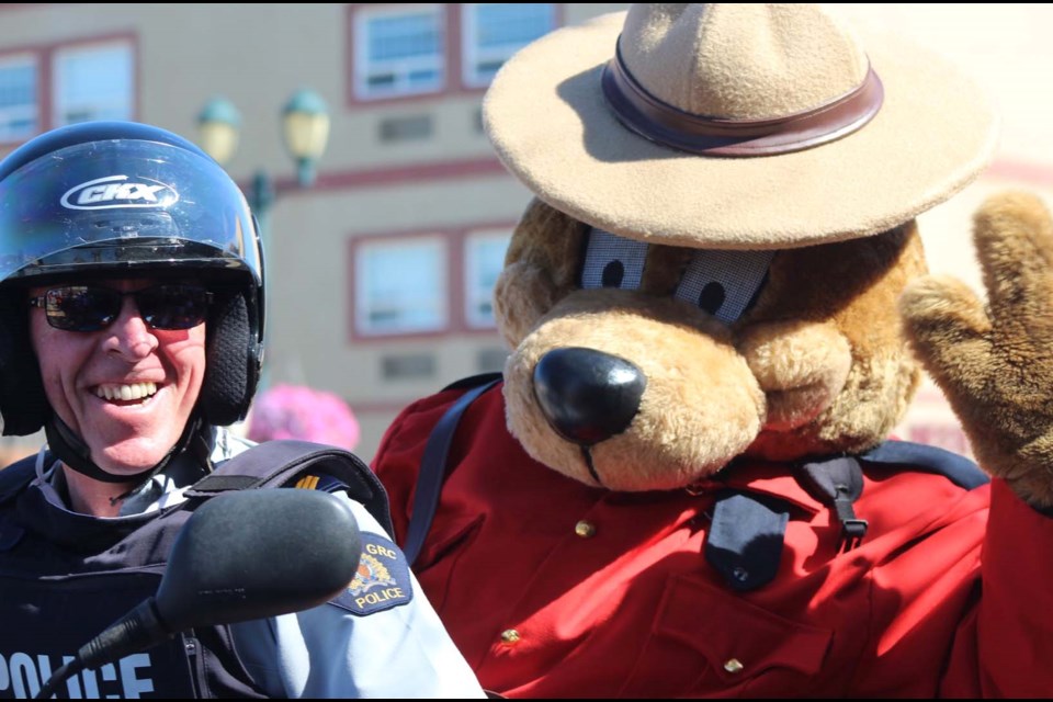 Lac La Biche RCMP Sgt. Charles Brown and the RCMP mascot at a recent Lac La Biche community parade. A new report has provincial officials re-engaging a path to explore replacing the RCMP in Alberta communities with a provincial police force.