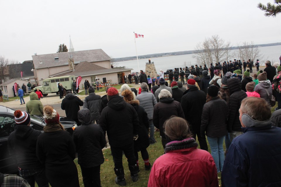 Crowds of residents line the road at the Lac La Biche Legion for the Remembrance Day ceremony.