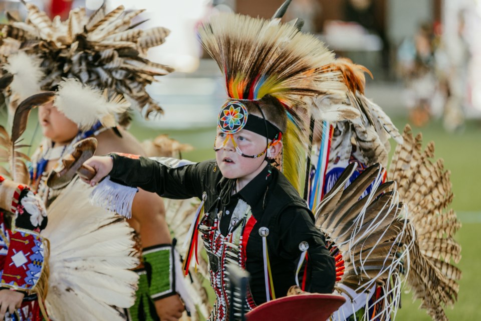 Grayson Cardinal takes part in the Saturday afternoon grand entry at the Saddle Lake Powwow, June 22.