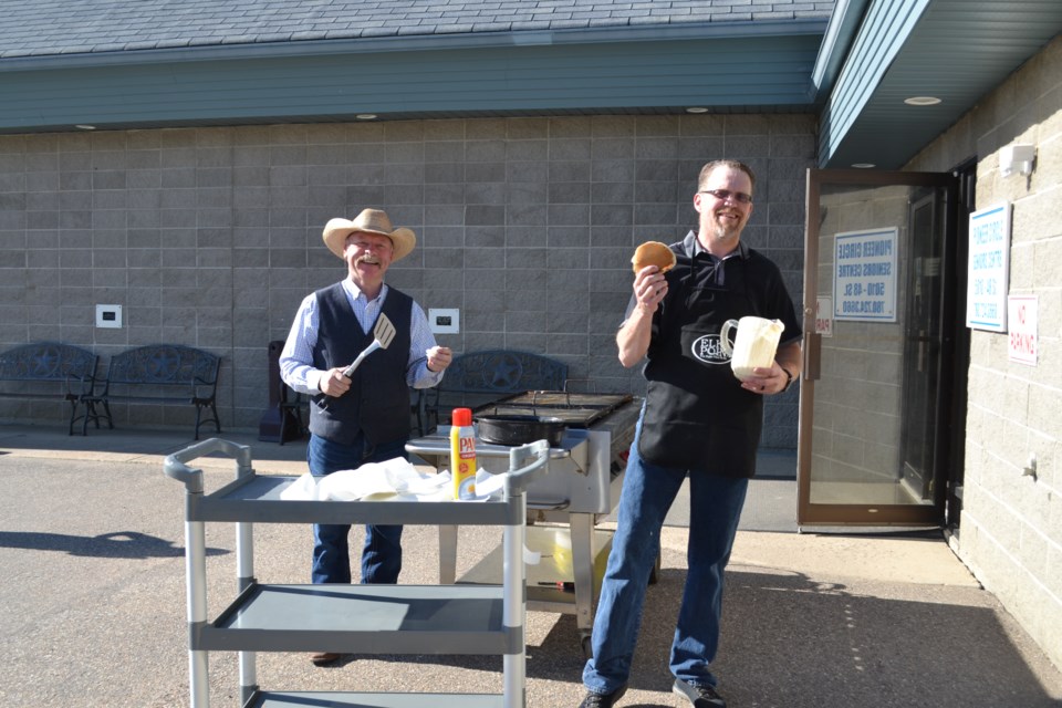 County of St. Paul Coun. Kevin Wirsta and Town of Elk Point Coun. Jason Boorse manned the grills on June 2,  as the Town and County kicked off Seniors Week 2024 with their traditional pancake breakfast.
