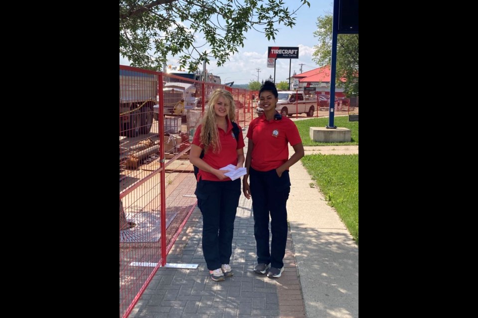 Kaitlyn Warkentin and Nidaar Teng-Yang on patrol in the Lac La Biche downtown core. The women are Lac La Biche County Street Ambassadors, serving as tour guides, and sources of local information for visitors and locals.