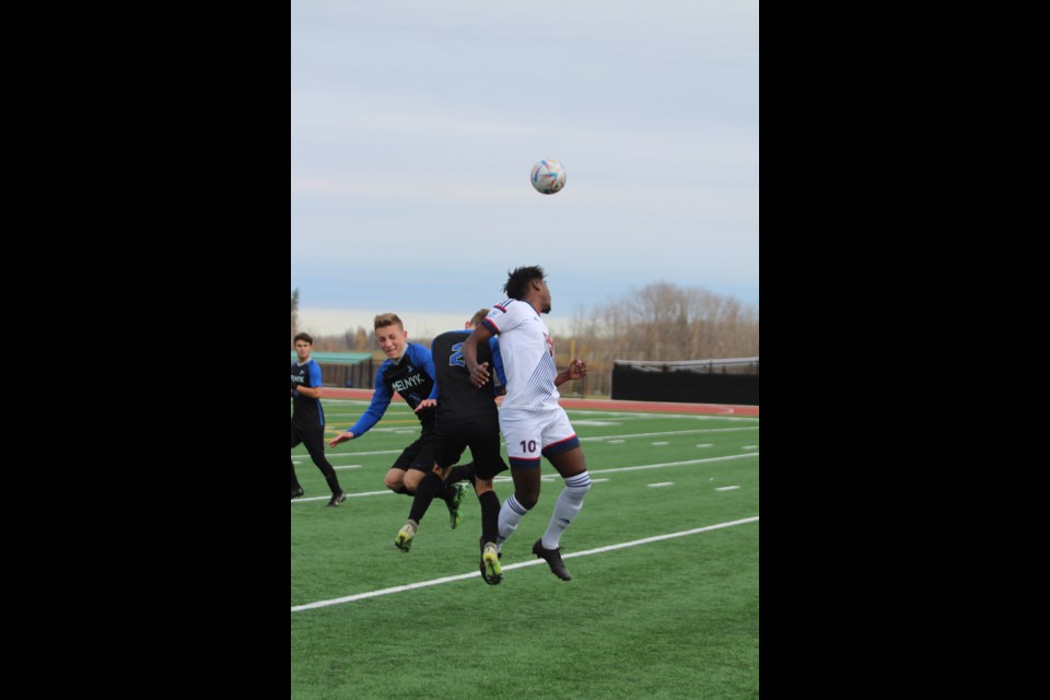 Voyageurs midfielder Tata Mugisha gets up first for the header in front of an Eagles rush during Saturdays 2-0 Eagles win at Lac La Biche's Bold Center Sports Field.