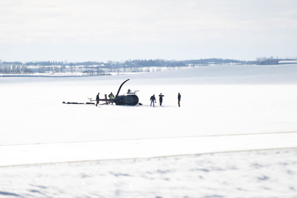 Emergency crews on scene at a helicopter crash, east of St. Paul, Feb. 24.