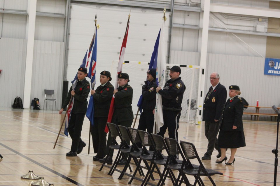 The colour party-comprised of army cadets, and representatives of the McGrane Branch of hte Royal Canadian Legion, Canadian military and Lac La Biche County Protective Services-marches to the front of the gymnasium at JA Williams High School (JAWS) for the Remembrance Day ceremony which took place at the school on Thursday, Nov. 9. 